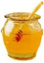 glass jar filled with honey